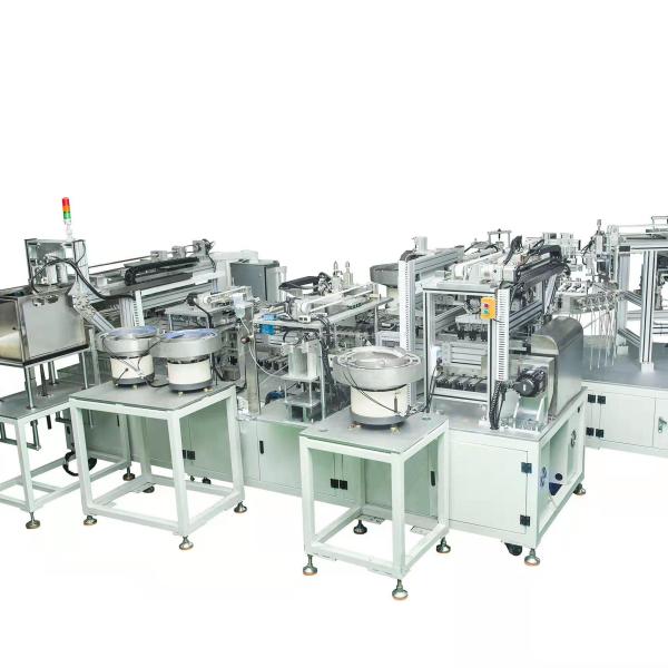 Automated assembly machine for blood collection needles with vibrating plate