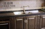 Customized Storage Solutions Stainless Steel Cabinetry With Dark Wood Finish