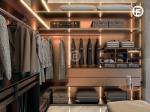 Rose Gold Stainless Steel U-Shaped Walk-In Closet With Ambient Lighting