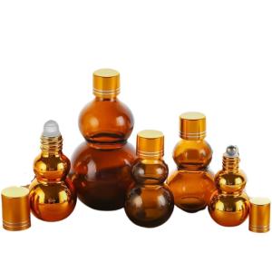 China Customizable Premium 10ml/50ml/100ml Amber Glass Perfume Oil Roll On Bottles With Golden Mirror Finish‌ Dual Golden Caps & Thickened Base‌ on sale