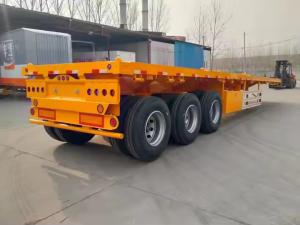 China CIMC 2.00&quot; King Pin 3mm Anti Slip Floor Plate With 12R22.5 Tire Specs 12 Set Twist Lock Flatbed Semi Trailer factory