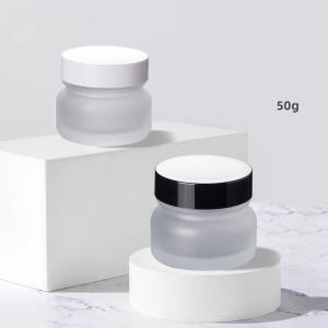 China Stock Luxury Skin Care Glass Jar 50g Empty Frosted Cosmetic Packaging with Black Lid and Glass Bottle Plastic Cap White Disc factory