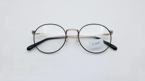 China Two tone black gold eyeglasses vintage round titanium frame for Women Men clear lens anti blue eyeglasses factory