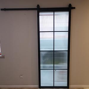 China Frosted Glass Aluminum Steel Frame Interior Barn Door With Sliding Hardware factory
