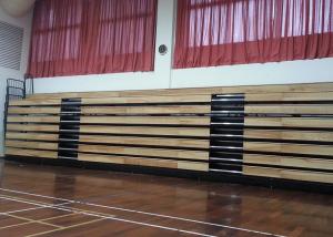 China Motorized Retractable Gym Seating Wooden Bench For Multi - Functional Hall factory