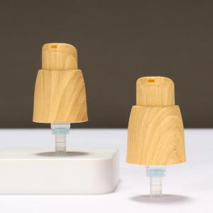 China Outer Spring Airless 0.25cc Plastic Lotion Pump Hand Lotion Pump With Wood Grain factory