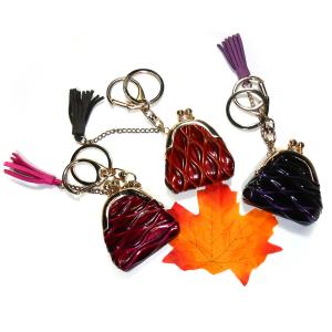 China ODM Coin Wallet Embossed Leather Keychain With Red Tassel Decoration factory