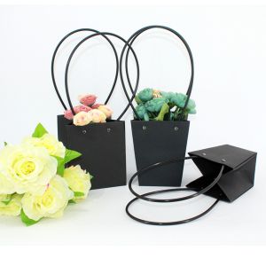 China Waterproof Flower Packaging Carry Kraft Paper Bag With Plastic Handle on sale
