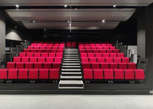 China Indoor Cultural Center Retractable Bleachers With Soft Folding Chair Seating factory
