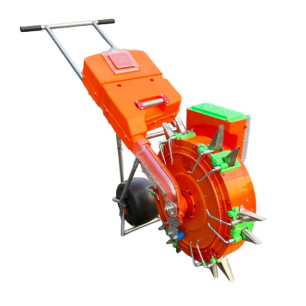 Hand-push seeder and fertilizer applicator in operation