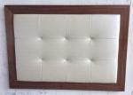 Wood frame fabric upholstery button tufted king size headboard of hotel bedroom