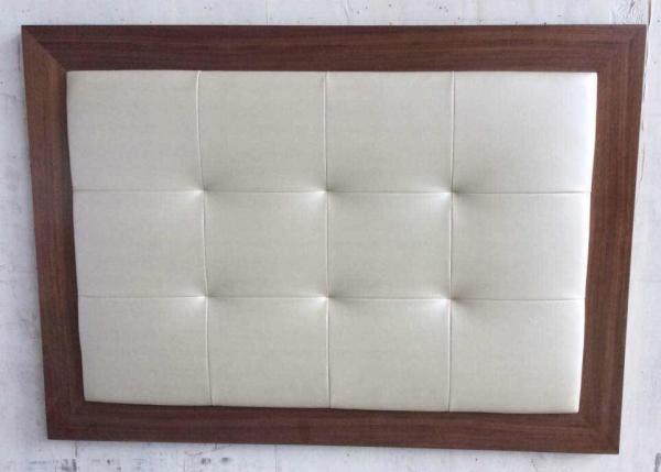 Wood frame fabric upholstery button tufted king size headboard of hotel bedroom