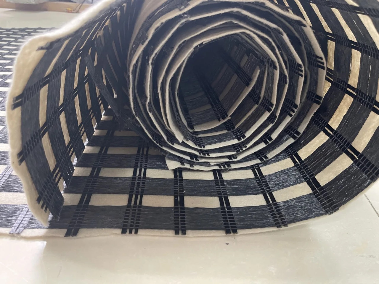 Rigid Strength Composite Geogrid 20 Kn 30 Kn 40 Kn Biaxial Geotextile Composite Polyester Geogrid