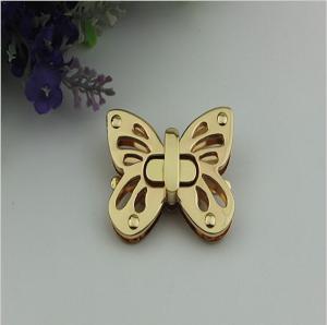China Shiny gold metal zinc alloy butterfly pattern fashion purse turn locks factory
