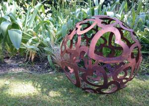 China Large Heart Pattern Corten Steel Sculpture Hollow Sphere Metal Garden Ball factory