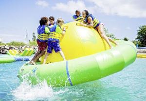 China Customized Inflatable Water Toys Aqua Park Green Inflatable Saturn For Kids And Adults factory