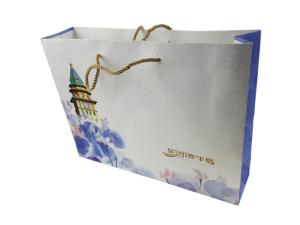China Gift Packaging Paper Bags Customized Size Cardboard Material CMYK Color Printing with Gold Color Rope Handle factory