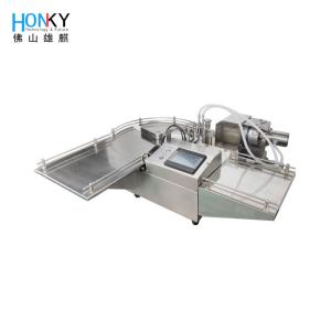 China Desktop Round Bottle Filling Machine With Double Head Filling System For Oil Liuqid Essential Filling factory