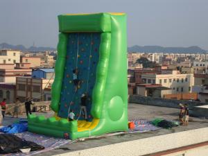China PVC Tarpaulin Outdoor Inflatable Amusement Park With Green Rock Climbing Wall factory