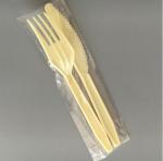 Disposable plastic knives and forks in a fast food restaurant individual package