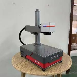 China 20KG Metal Engraving Machine Portable 20w 30w 50w Mopa Gold Metal Smart Color Fiber Laser Marking Machine factory
