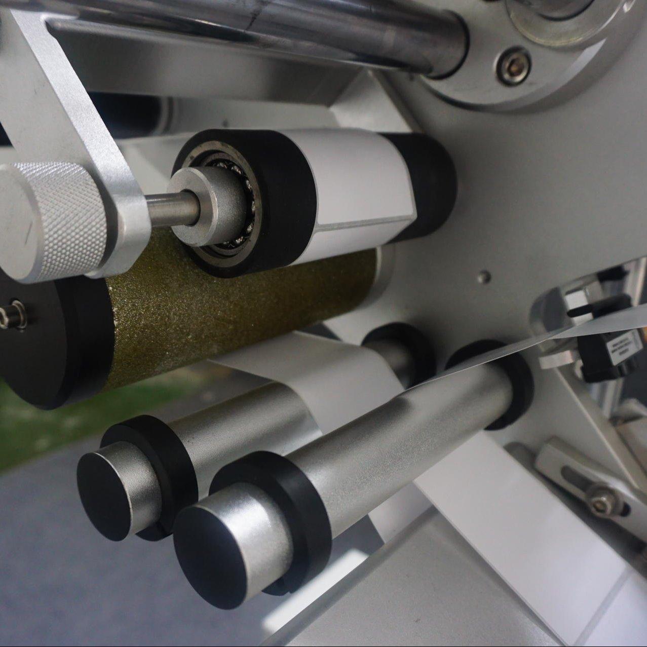 Close-up view of labeling mechanism and control system