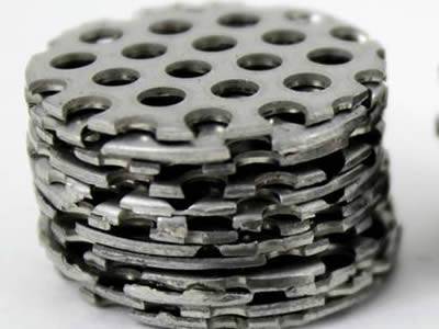 Perforated filter disc with unified, round and micro holes without margin.
