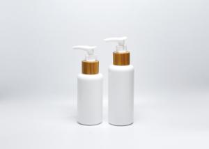 China 3.3OZ 4OZ boston round opal white glass bottles with real bamboo-plastic lotion pump, skincare packaging wholesale factory