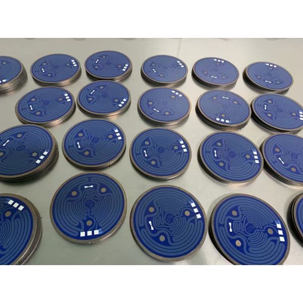 Close-up of flatbed screen printing machine components