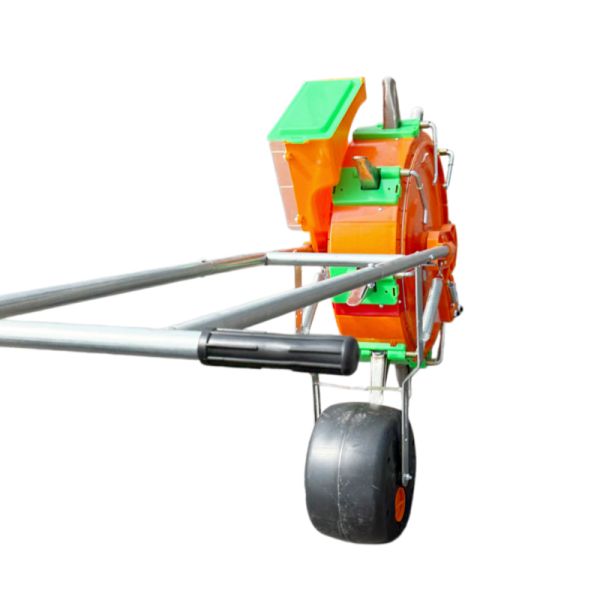 Close-up view of manual seeder machine nozzle and adjustment mechanisms