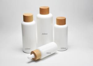 China Jade White 40, 100, 120ml Boston Round Opal Glass Bottles With Wooden-Plastic Clousures, Glass Primary Medical Packaging factory