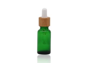 China Green Oil 18mm Cosmetic Glass Dropper Bottles With Bamboo Dropper Printing Pipette factory