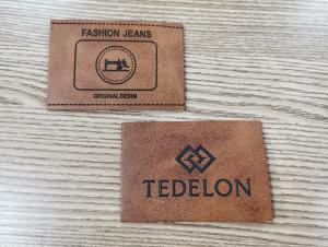 China Embossed Logo PU Leather Patches Custom Color Sew On Clothing factory