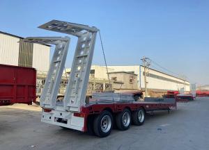 China Jost E100 3 Axle 60 Tons 100 Tons Hydraulic Extendable Lowboy Low Bed Truck Semi Trailer factory