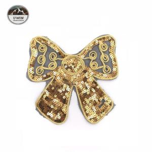 China Golden Bow Rope Sequin Embroidery Patches 21*17CM Size With Merrowed Border factory