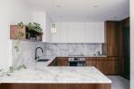 Modern Modular Kitchen Cabinets In Wood Finish Black Stone Countertop With