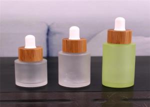 China 2oz Liquid Essence Bottle With Bamboo Lid Glass Dropper Bottle For Cosmetic Packaging factory