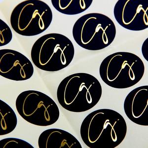China Black Round Matte Black Paper Sticker Labels With Gold Logo factory