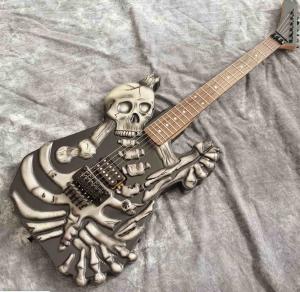 China Skull Carving Body 6 Strings Electric Guitar in Matte Black Color factory