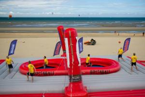 China 0.9mm PVC Inflatable Volleyball Court Sand Beach Blow Up Bossaball Game factory