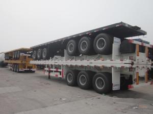 China tri-axle container semi-trailer lowest price 40ft flat bed trailer with container locks factory