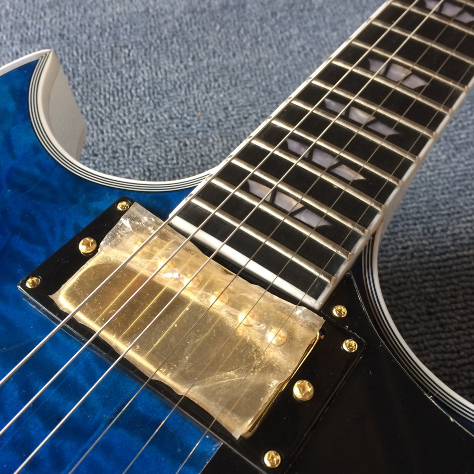 High quality Jazz Electric Guitar with Bigsby, Ebony Fingerboard, Guitar Quilted Maple Trans-Blue burst color