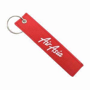 China Double Stitching Custom Embroidered Keychain Metal Loop Design Flight Tag Keyring on sale
