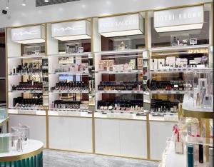 Golden Luxury Cosmetic Display Cabinet 4 Layers With Acctrative Advertising Light Box Cosmetic Display Stand
