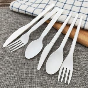 China Wholesale Set Of Biodegradable CPLA Disposable Cutlery Composed Of Knife Fork Spoon For Parties Paper Wrapped Tableware factory